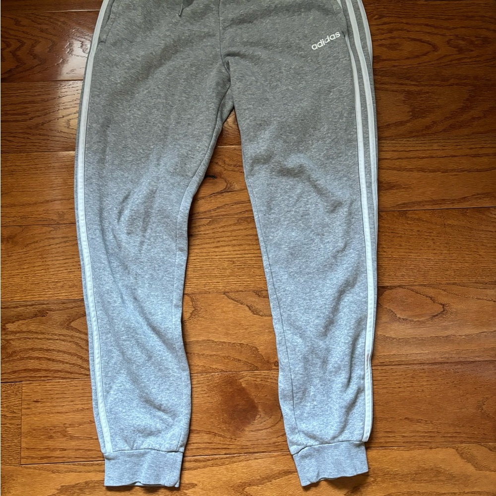 3 pack women sweatpants. 1 Gray and 1 Black Adidas sweats. 1 Black sweatpants.